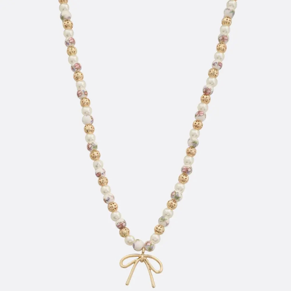 Joia Accessories Eloise Beaded Necklace – Elegant Bow Pendant